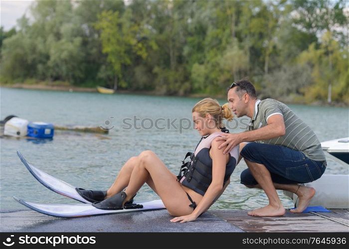 she is learning waterski with instructor