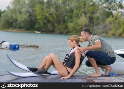 she is learning waterski with instructor