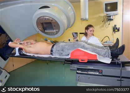 she is lying down for x-ray