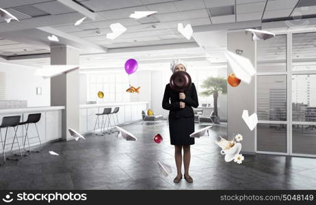 She is magician as cook. Attractive woman chef in suit with pan in hand