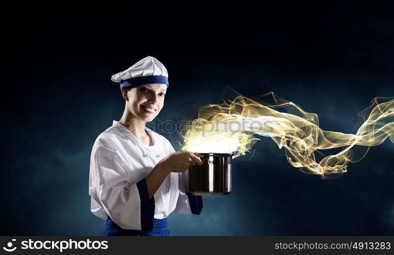 She is magician as cook. Pretty woman cook in hat and apron with pot in hands