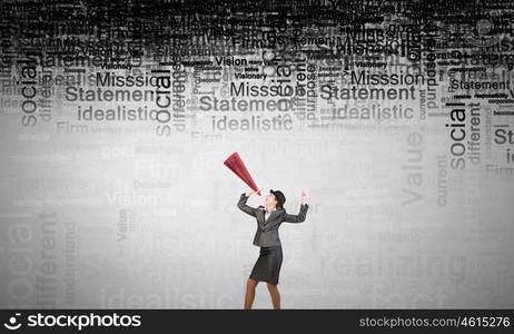 She is making announcement. Young woman in suit and bowler hat screaming in paper trumpet