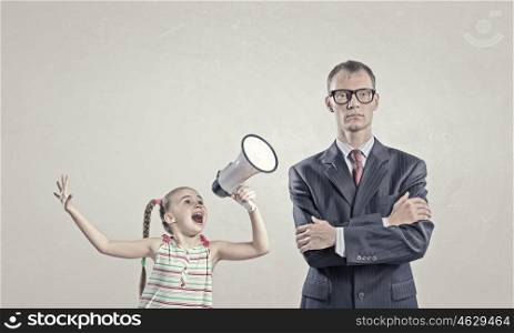 She is not heard. Child screaming with megaphone to adult indifferent man