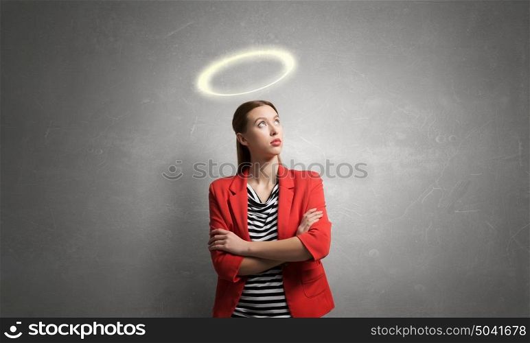 She is pure angel. Young saint woman with halo above head