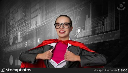 She is super financier. Young businesswoman in red cape acting like super hero