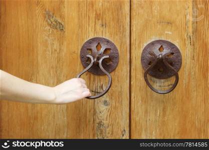 She opening the old wooden door