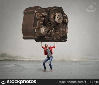 She possesses constructive thinking. Young woman in red jacket and gear mechanism