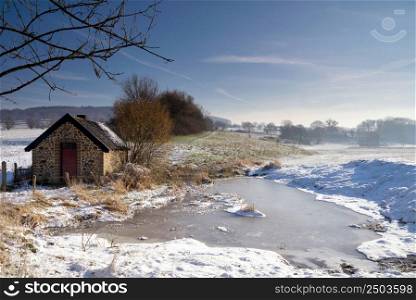 Shed in a winter landscape close to the Dutch village Epen in the province Limburg. Shed in a winter landscape close to Epen