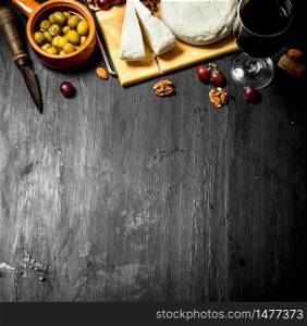 Sheep cheese with red wine , nuts and olives .. Sheep cheese with red wine , nuts and olives.