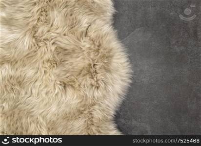 Sheep fur. Sheepskin rug background. Wool stone texture