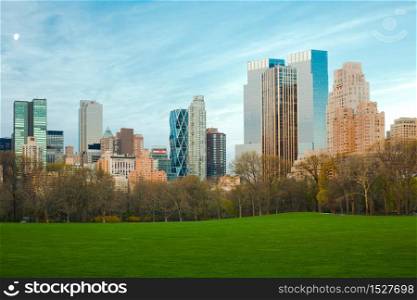 Sheep Meadow at Central Park and Midtown skyline, New York City, NY, USA