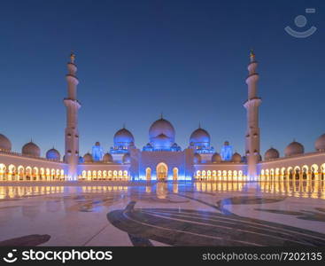 Sheikh Zayed Grand Mosque Center, Abu Dhabi. The largest mosque in United Arab Emirates or UAE. Muslim or Islamic white architecture building. Landmark tourist attraction.