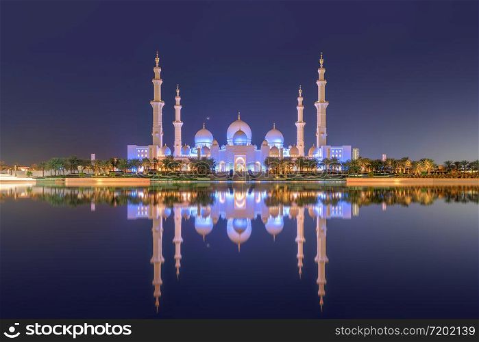Sheikh Zayed Grand Mosque Center, Abu Dhabi. The largest mosque in United Arab Emirates or UAE. Muslim or Islamic white architecture building. Landmark tourist attraction.
