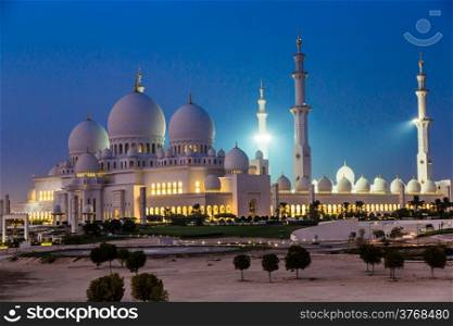 Sheikh Zayed Mosque illuminated at night. Abu Dhabi, United Arab Emirates