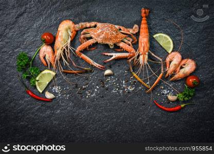 Shellfish seafood plate with shrimps prawns crab ocean gourmet dinner seafood cooked with herbs and spices on dark background