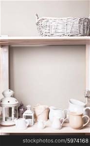 Shelves in the rack in the kitchen at shabby chic style. Shelves in the rack