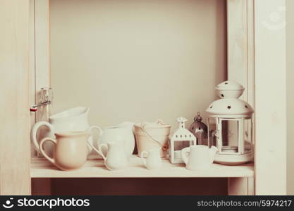 Shelves in the rack in the kitchen at shabby chic style. Shelves in the rack