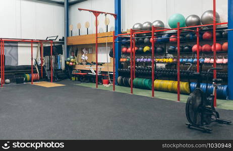 Shelves with sports equipment inside a gym. Shelves with sports equipment indoor