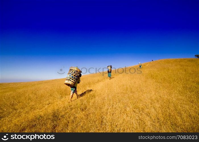 Sherpas man carry on baggage basket to top of mountain, Chiang mai Thailand