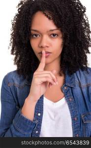 Shhhh! Silence please!. Beautiful african young woman asking for silence isolated