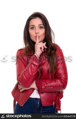 Shhhh! Silence please!. Beautiful young woman asking for silence isolated