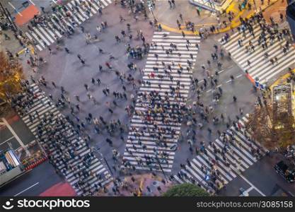 Shibuya Crossing from top view at night in Tokyo, Japan (slow shutter speed blur effect)