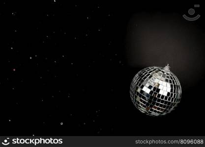 Shining glitter disco ball on black background. Shining disco ball