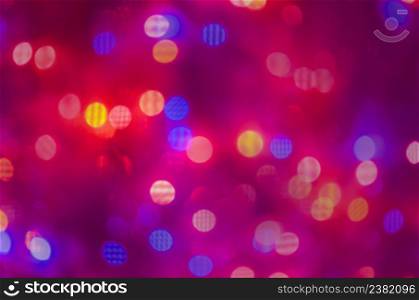 Shining red background. Red defocused lights background. Abstract christmas red lights background