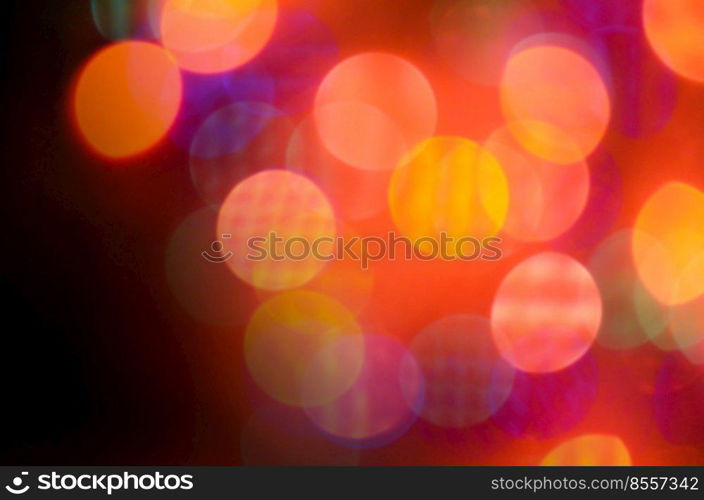 Shining red background. Red defocused lights background. Abstract christmas red lights background retro style toned