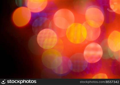 Shining red background. Red defocused lights background. Abstract christmas red lights background retro style toned