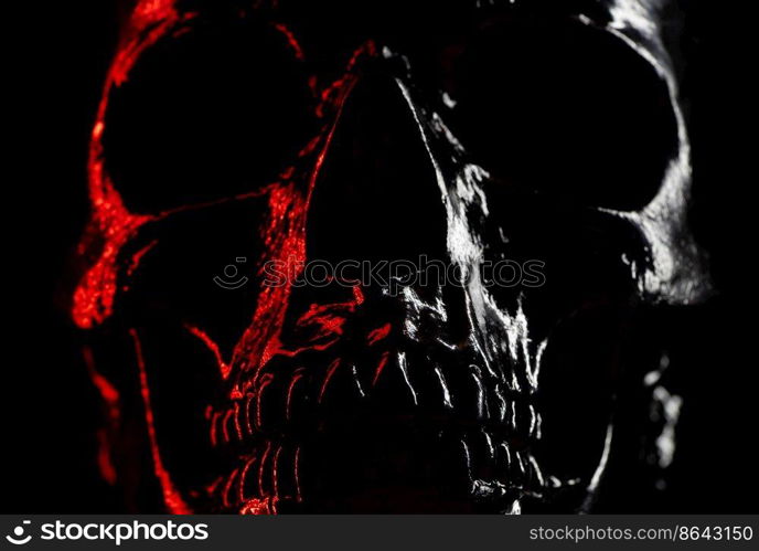 Shining skull head on dark background with neon red light. Halloween celebration, glamour, style concept. fear and horror. Shining skull head on dark background with neon red light. Halloween celebration, glamour, style concept. fear and horror.