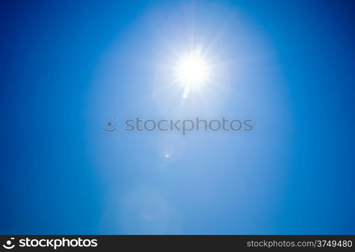 Shining sun at clear blue sky