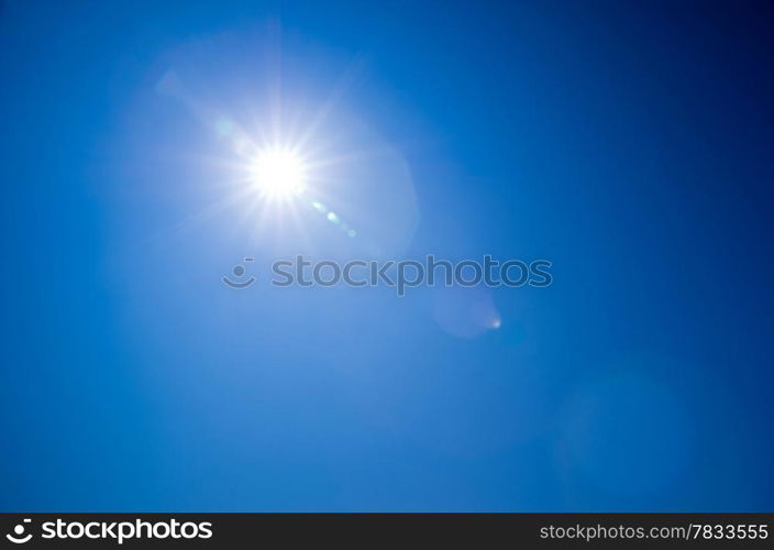 Shining sun at clear blue sky