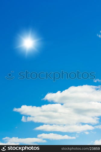 Shining sun at clear blue sky with copy space