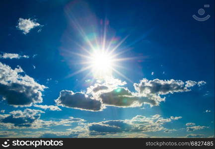 Shining sun at clear blue sky with copy space