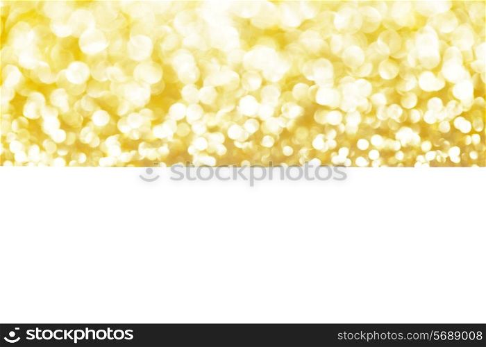 Shiny abstract golden defocused glitter background