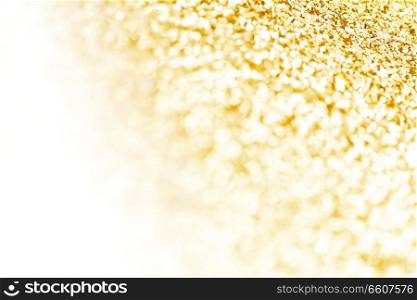 Shiny abstract golden defocused glitter background