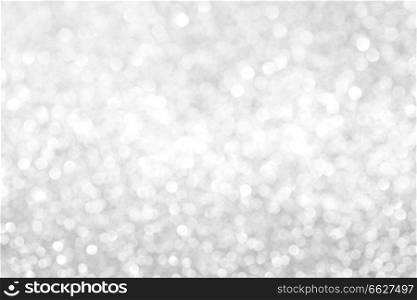 Shiny abstract silver defocused glitter background