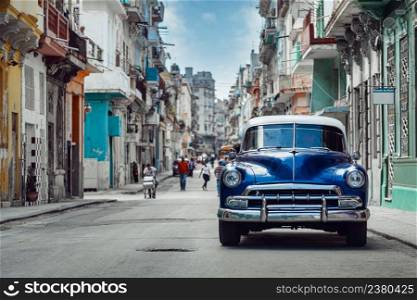 Shiny blue retro car parked on the street of Havana, Cuba