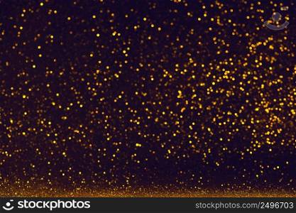 Shiny falling glitter dust background. Abstact glitter sparks on dark backdrop.