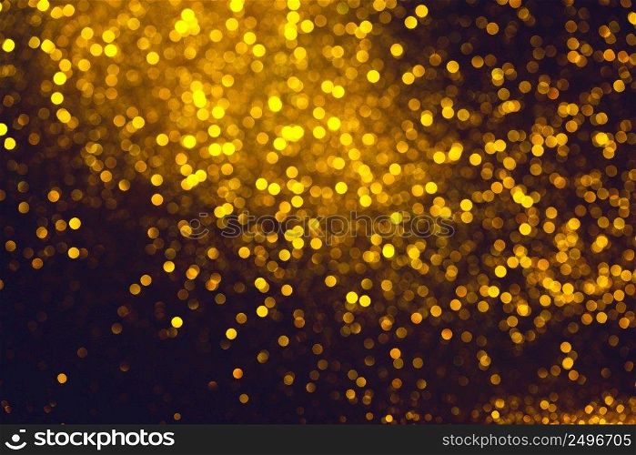 Shiny festive defocused glitter burst on black background