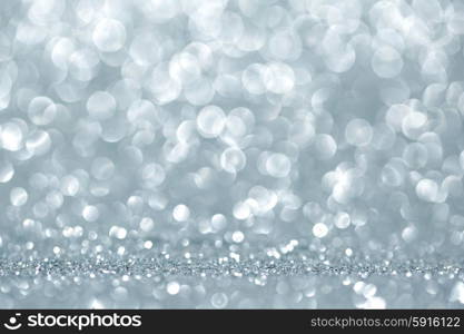 Shiny glitter bokeh background. Abstract silver shiny glitter bokeh christmas background