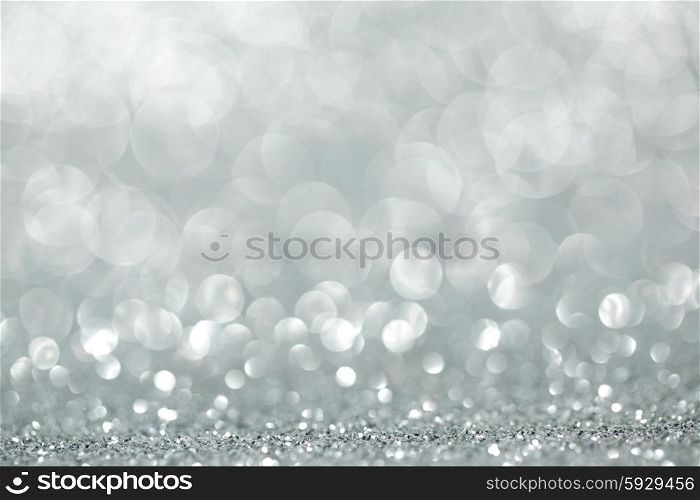 Shiny glitter bokeh background. Abstract silver shiny glitter bokeh christmas background