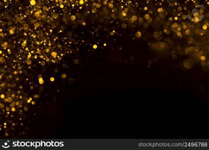 Shiny gold glitter flowing dust border frame on dark background