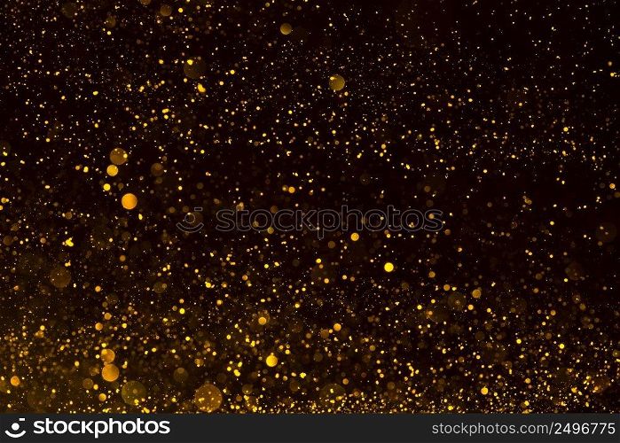 Shiny gold glitter particles abstract background