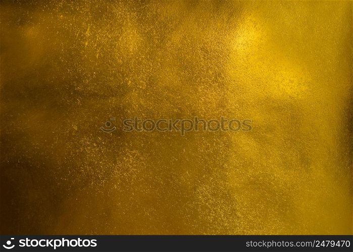 Shiny goldem textured paper sheet background
