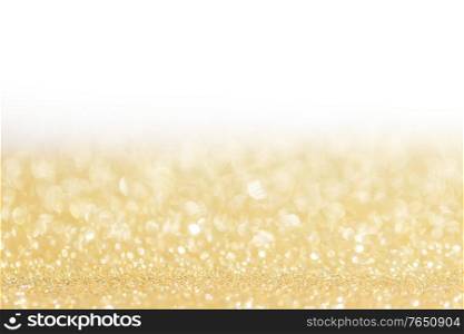 Shiny golden bokeh glitter lights abstract background, Christmas New Year party celebration concept. Shiny golden lights background