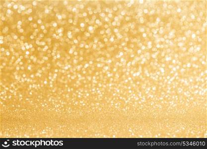 Shiny golden lights background. Shiny golden bokeh glitter lights abstract background, Christmas New Year party celebration concept