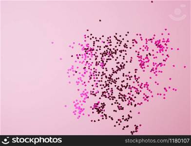 shiny pink confetti on a pink background, festive backdrop for birthday, valentines day. Festive decoration element. Flat design
