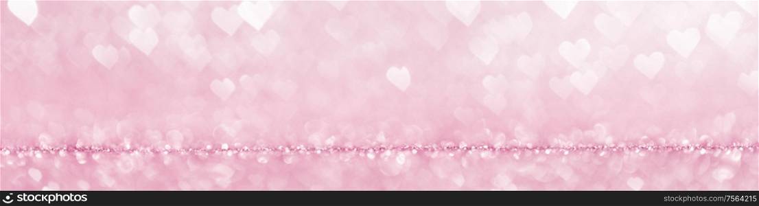 Shiny pink heart love bokeh glitter lights abstract background, Valentine&rsquo;s day party celebration concept. Shiny pink lights background
